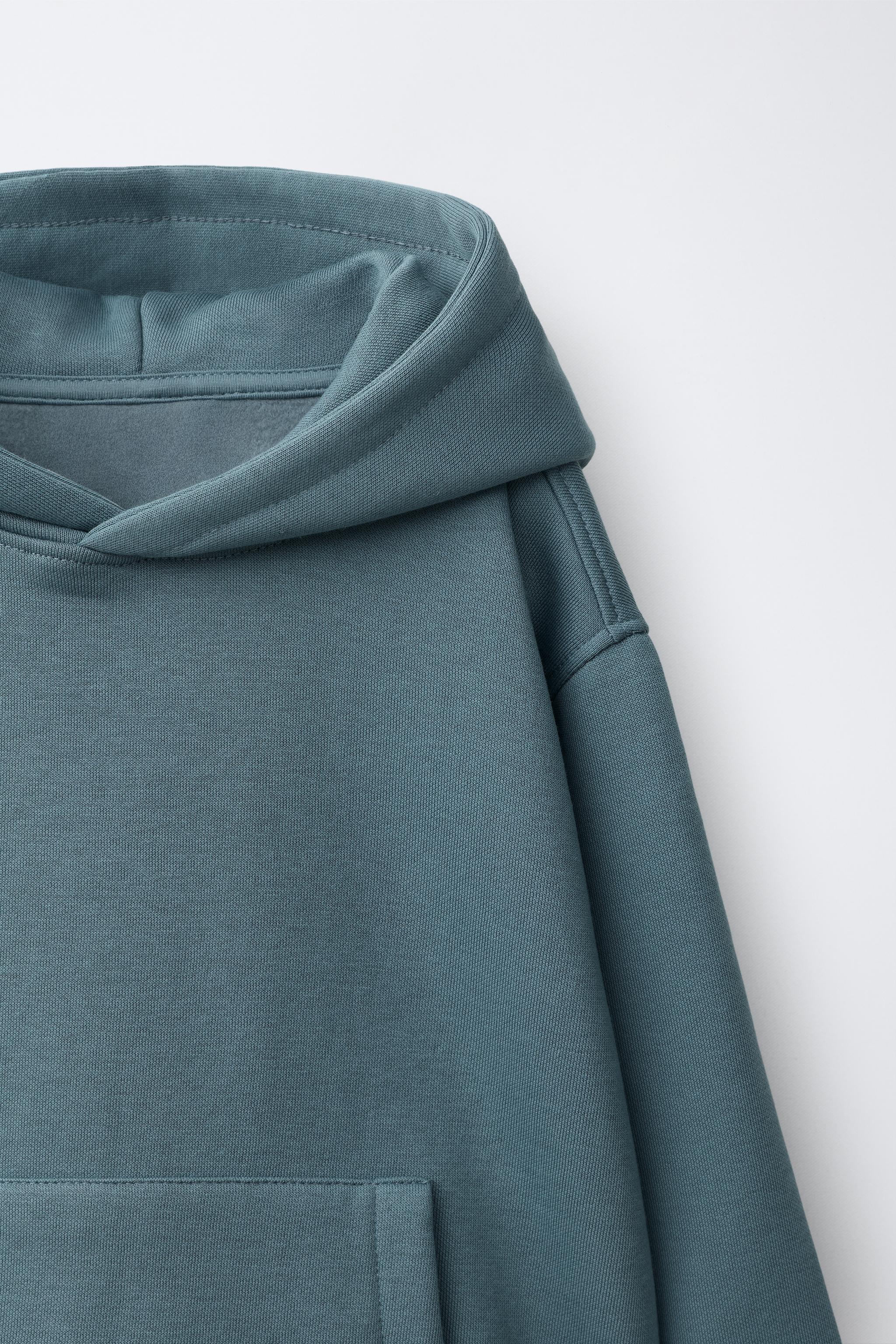 SWEAT UNI À CAPUCHE